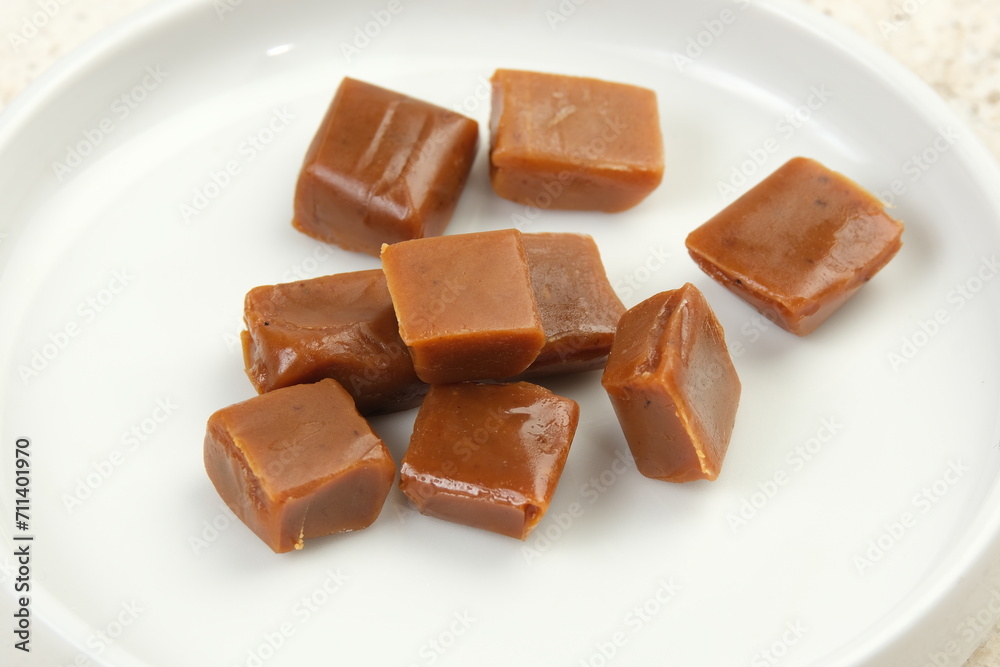 Caramel candies on a white background. Caramel candies on a white background.