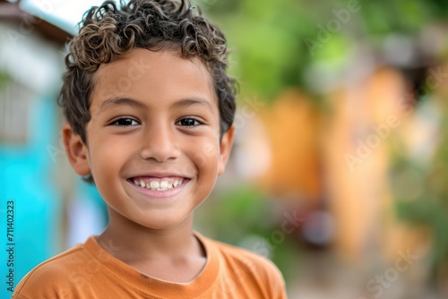 a hispanic kid smile at camera