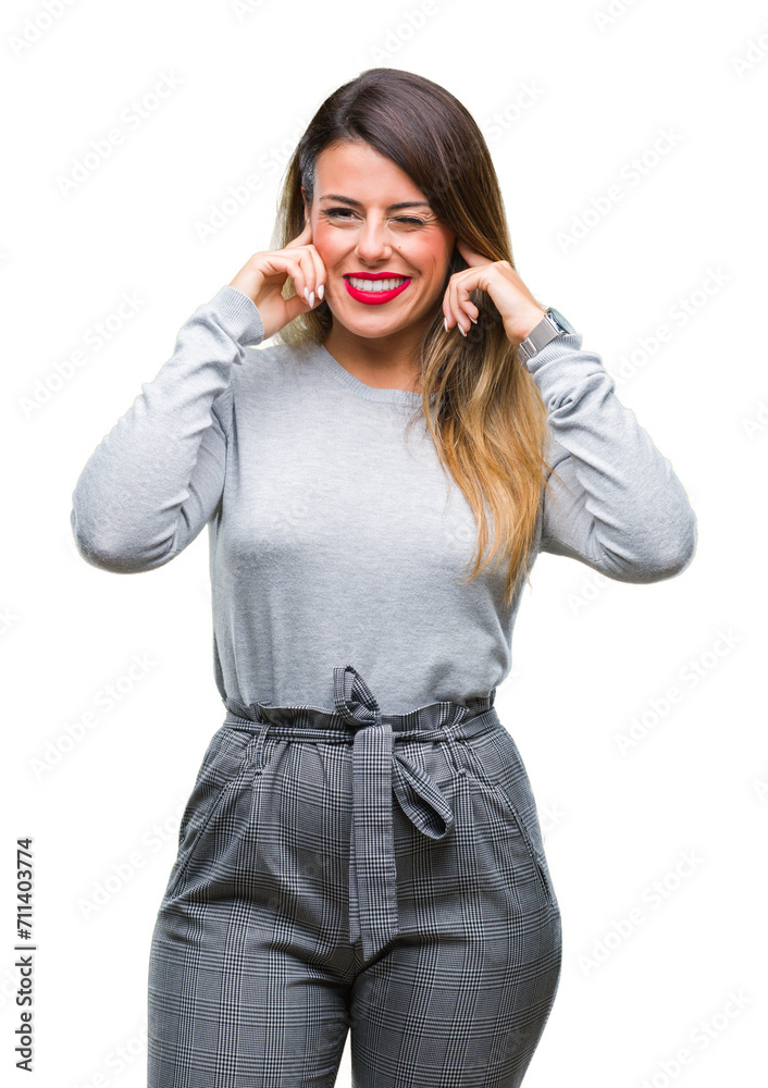 Young beautiful worker business woman over isolated background covering ears with fingers with annoyed expression for the noise of loud music. Deaf concept. Young beautiful worker business woman over isolated background covering ears with fingers with annoyed expression for the noise of loud music. Deaf concept.