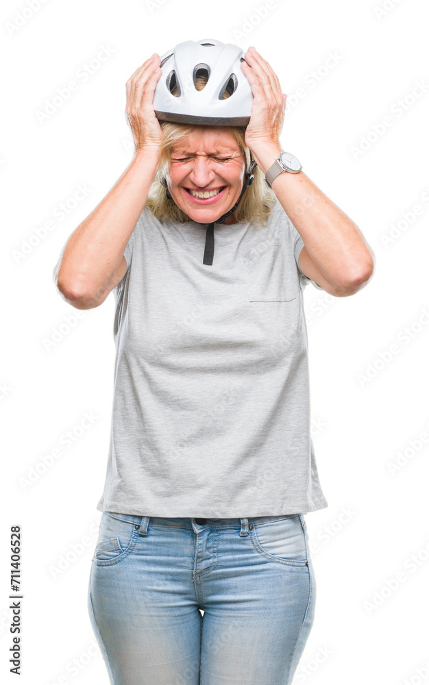 Middle age caucasian cyclist woman wearing safety helmet over isolated background suffering from headache desperate and stressed because pain and migraine. Hands on head. Middle age caucasian cyclist woman wearing safety helmet over isolated background suffering from headache desperate and stressed because pain and migraine. Hands on head.