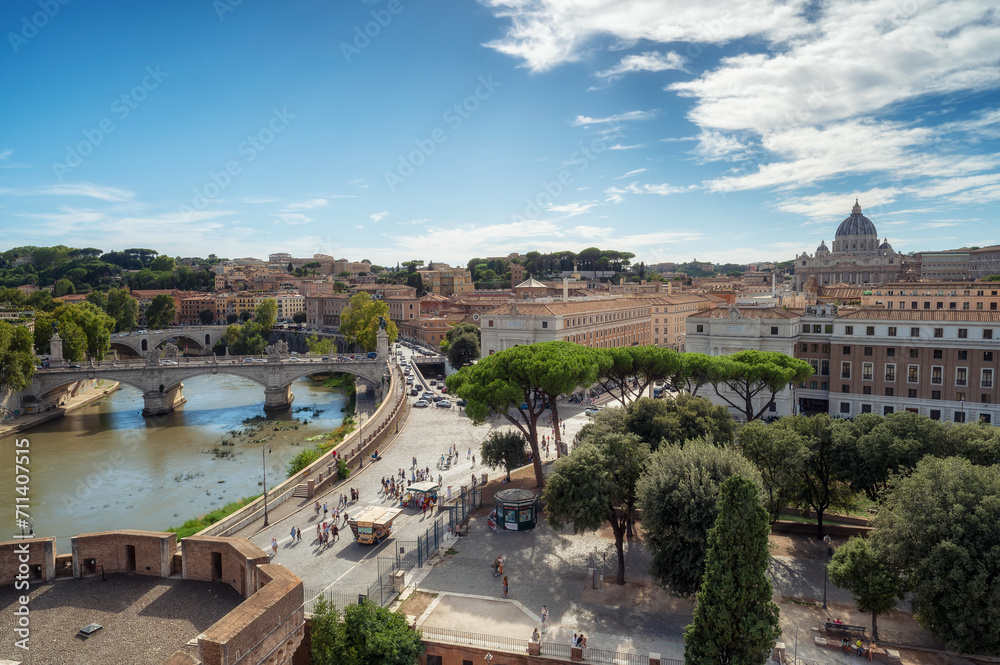 Panoramic view of Rome Skyline with the famous Vatican St Peter Basilica and bridges above Tiber River in Rome, Italy. Aerial view from the terrace of Saint Angelo castle.