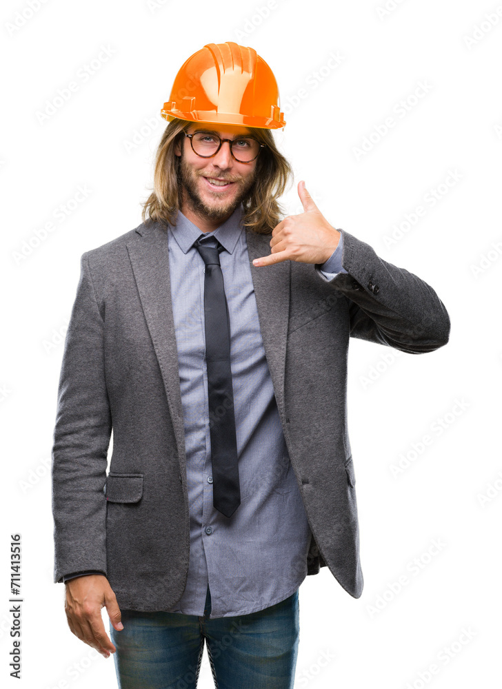 Young handsome architec man with long hair wearing safety helmet over isolated background smiling doing phone gesture with hand and fingers like talking on the telephone. Communicating concepts. Young handsome architec man with long hair wearing safety helmet over isolated background smiling doing phone gesture with hand and fingers like talking on the telephone. Communicating concepts.