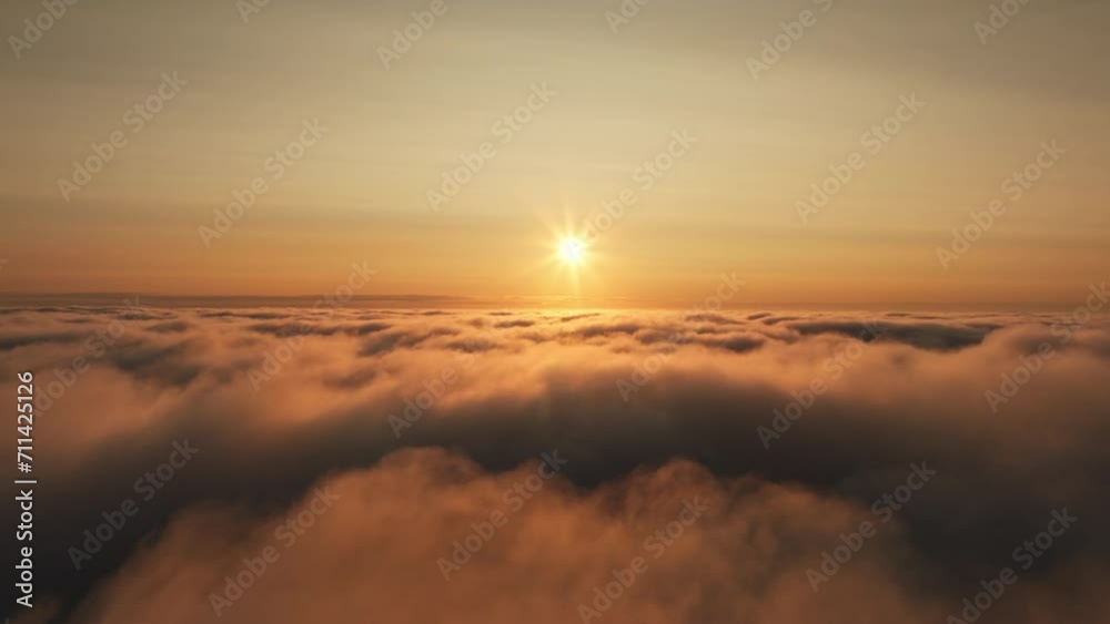 Aerial view high above scenic clouds at sunrise Aerial view high above scenic clouds at sunrise