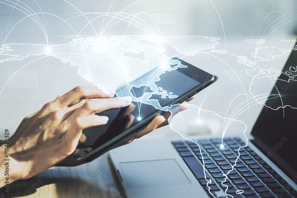 Double exposure of abstract digital world map with connections and hand working with a digital tablet on background, big data and blockchain concept Double exposure of abstract digital world map with connections and hand working with a digital tablet on background, big data and blockchain concept