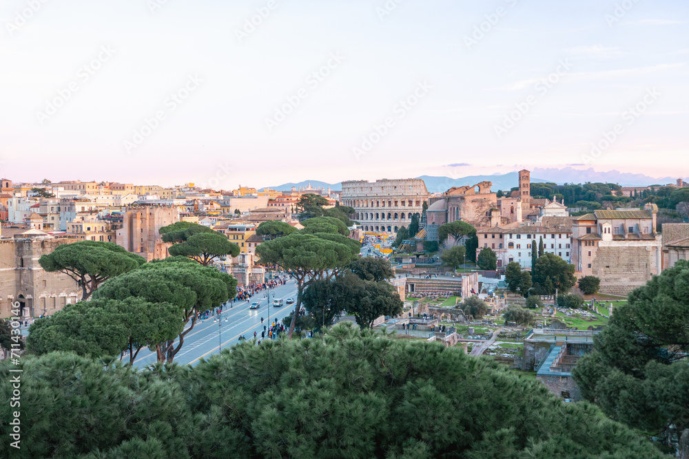 Ancient Rome, Coliseum (Colosseo), Imperial Forums (Fori Imperiali) and aerial panoramic view of the ancient city. Via dei Fori Imperiali (Imperial Forums street)