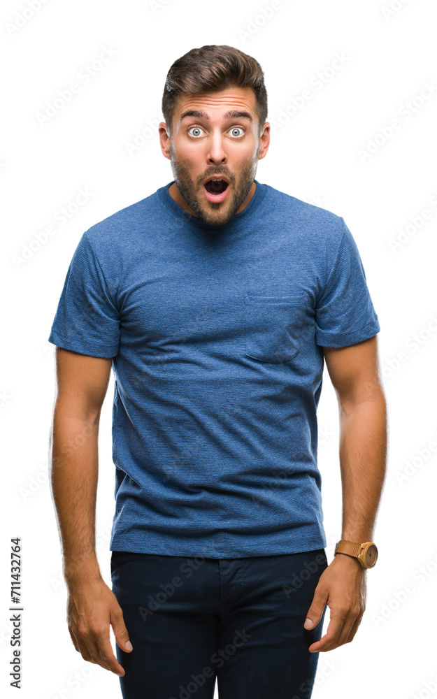 Fototapeta premium Young handsome man over isolated background afraid and shocked with surprise expression, fear and excited face.