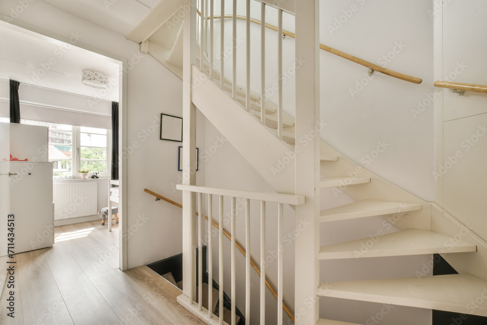 Modern home staircase with white and wooden details Modern home staircase with white and wooden details