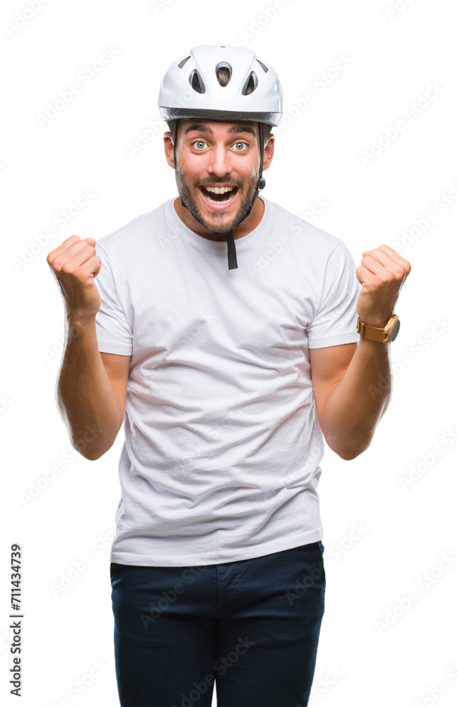 Young handsome man wearing cyclist safety helmet over isolated background celebrating surprised and amazed for success with arms raised and open eyes. Winner concept. Young handsome man wearing cyclist safety helmet over isolated background celebrating surprised and amazed for success with arms raised and open eyes. Winner concept.