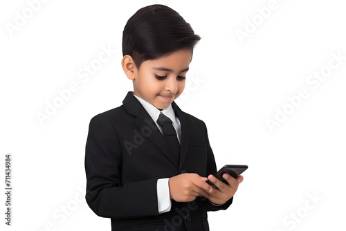 indian child boy in suit browsing on mobile phone isolated on white background