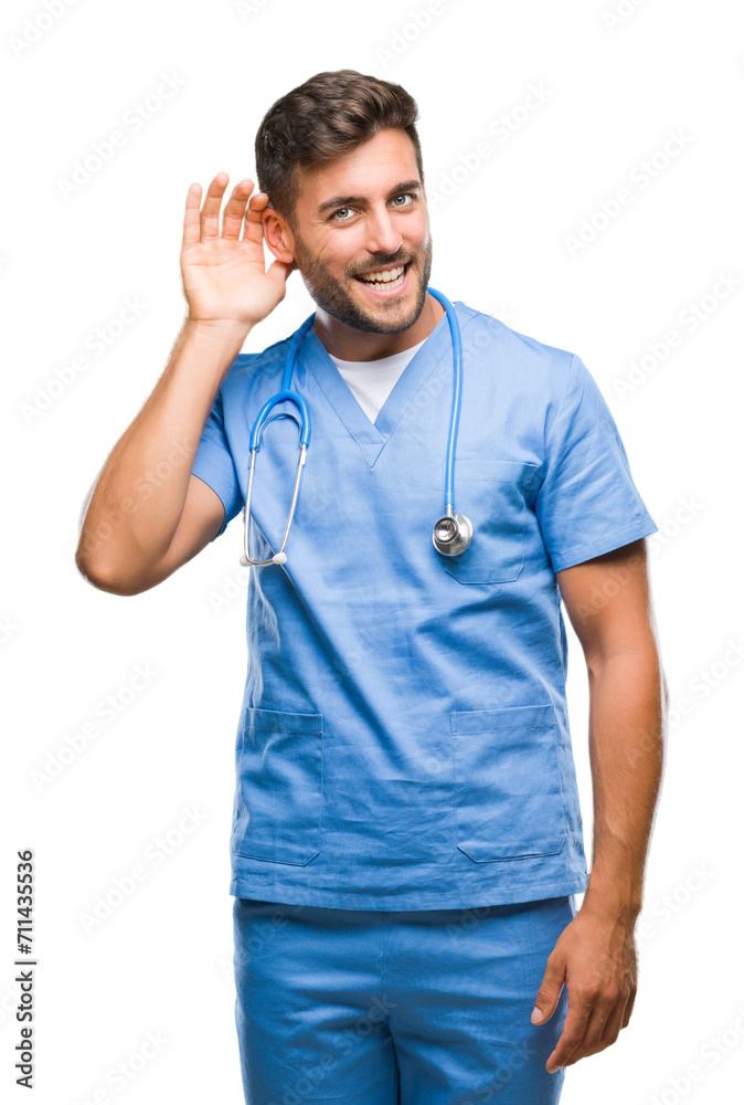 Young handsome doctor surgeon man over isolated background smiling with hand over ear listening an hearing to rumor or gossip. Deafness concept. Young handsome doctor surgeon man over isolated background smiling with hand over ear listening an hearing to rumor or gossip. Deafness concept.