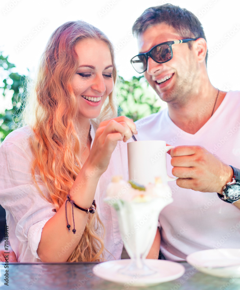 Young couple enjoying coffee at a street cafe Young couple enjoying coffee at a street cafe