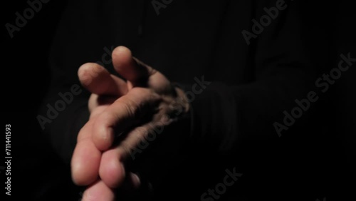 Close-up of man rubbing his hands palm to palm. Rubs palms in anticipation of something. Businessman rubbing his hands in anticipation of easy money, close up. Stranger sarcastically rubs his hands photo