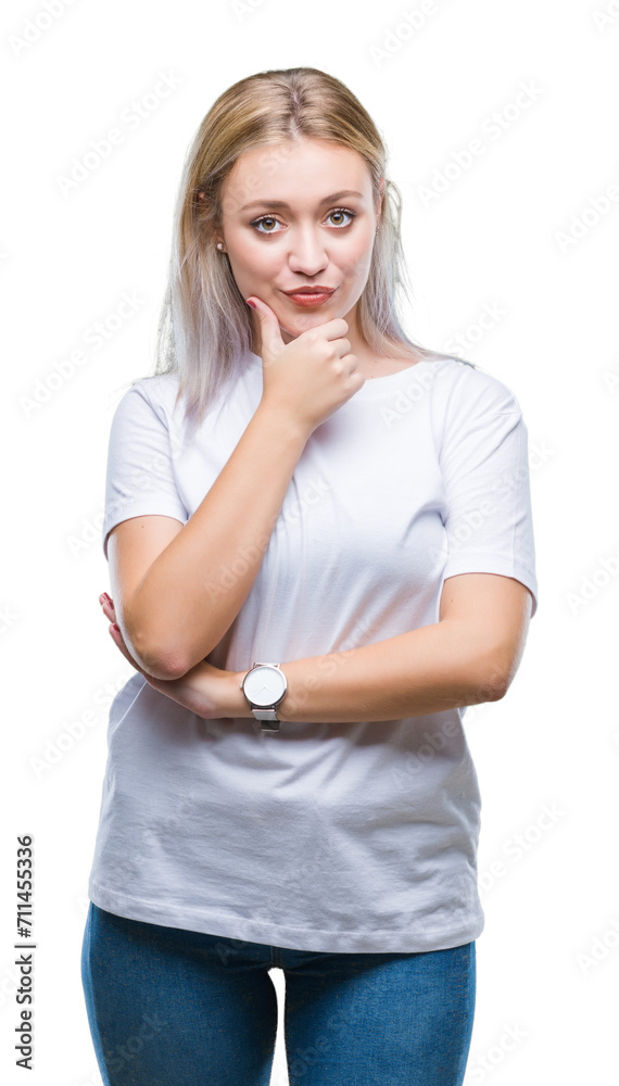 Young blonde woman over isolated background looking confident at the camera with smile with crossed arms and hand raised on chin. Thinking positive. Young blonde woman over isolated background looking confident at the camera with smile with crossed arms and hand raised on chin. Thinking positive.