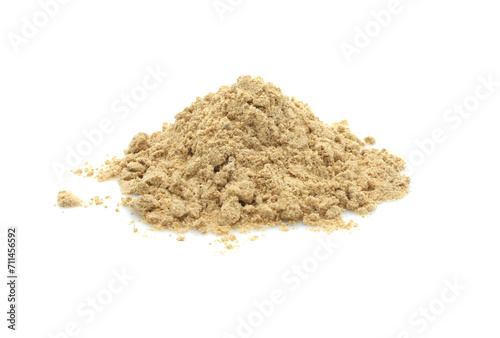 Ground ginger powder. Heap isolated on white background.