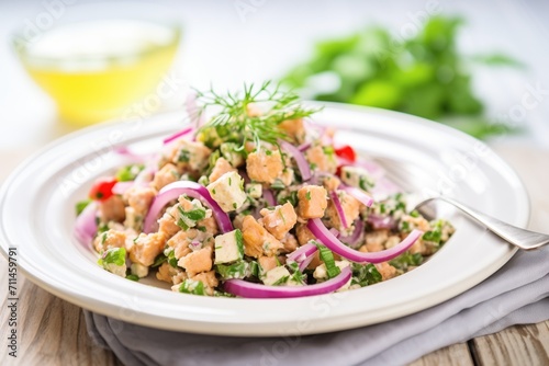 close-up of chickpea salad with feta cheese and red onion