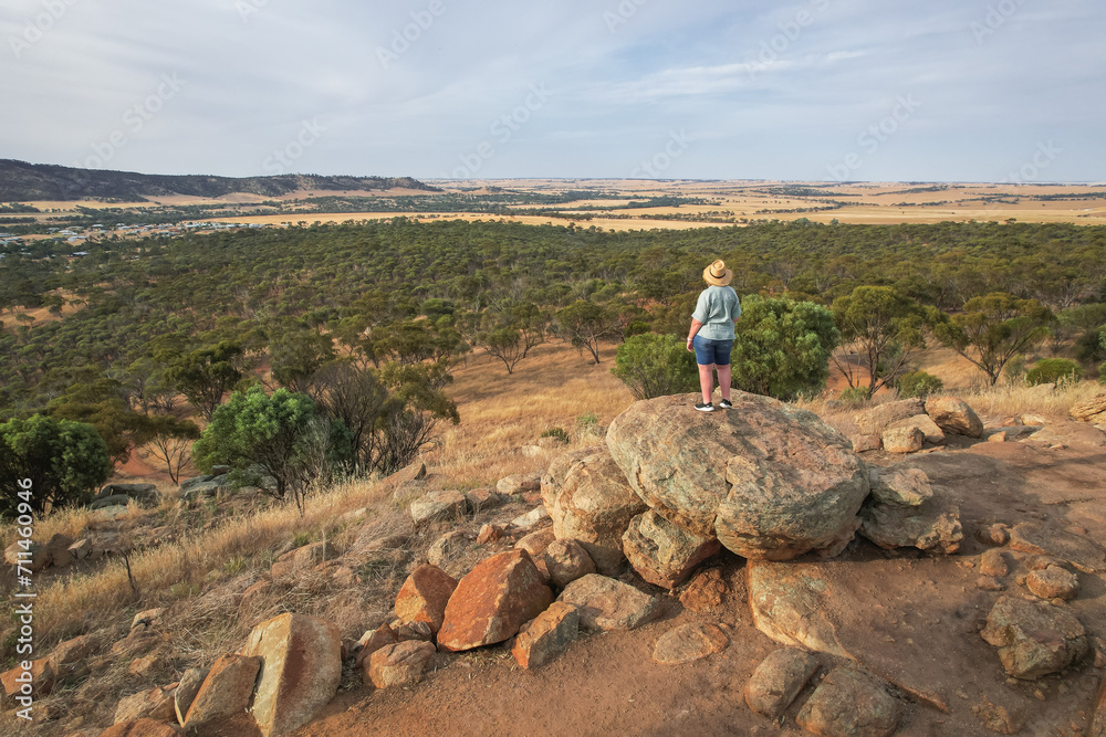 Woman looking out at the landscape from Mount Brown in York, Western Australia
