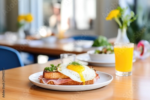 croque monsieur breakfast, paired with a sunny-side-up egg photo