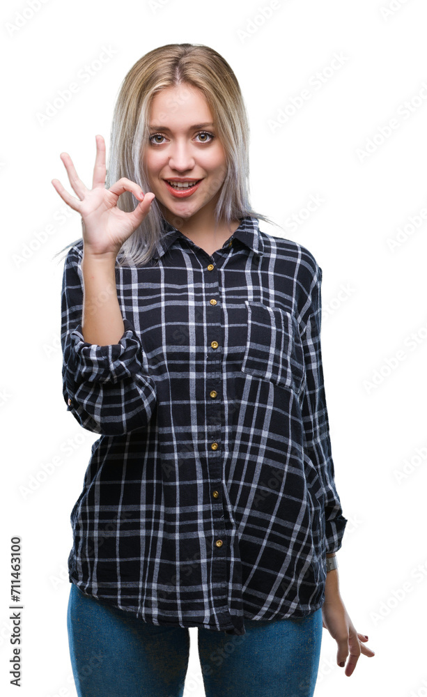 Young blonde woman over isolated background smiling positive doing ok sign with hand and fingers. Successful expression. Young blonde woman over isolated background smiling positive doing ok sign with hand and fingers. Successful expression.