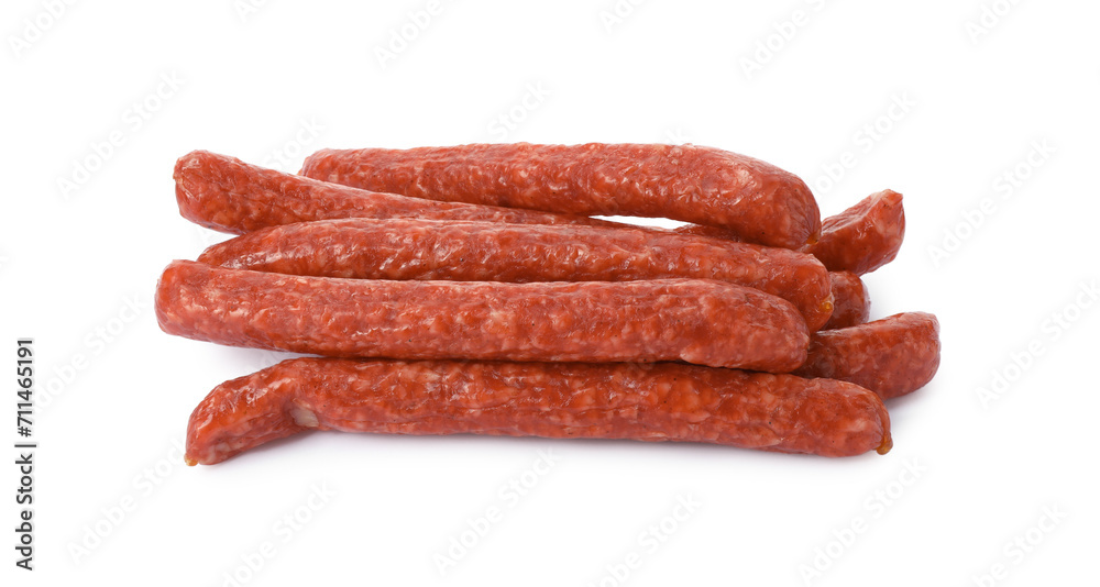 Many thin dry smoked sausages isolated on white