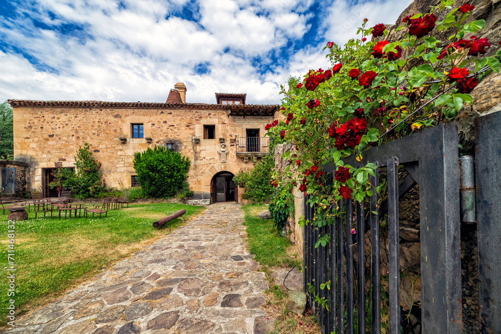 Big house with garden and flowers in Molinos de Duero. Soria. Spain. Europe.