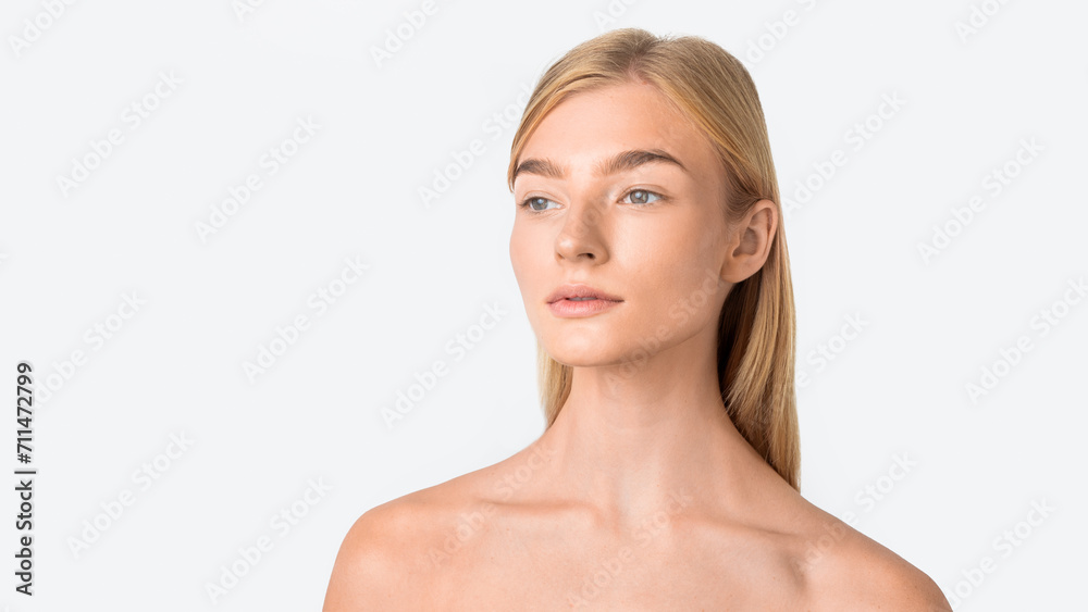 Portrait of blonde lady looking aside posing with calm expression Portrait of blonde lady looking aside posing with calm expression