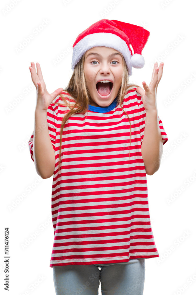 Young beautiful girl wearing christmas hat over isolated background celebrating crazy and amazed for success with arms raised and open eyes screaming excited. Winner concept Young beautiful girl wearing christmas hat over isolated background celebrating crazy and amazed for success with arms raised and open eyes screaming excited. Winner concept