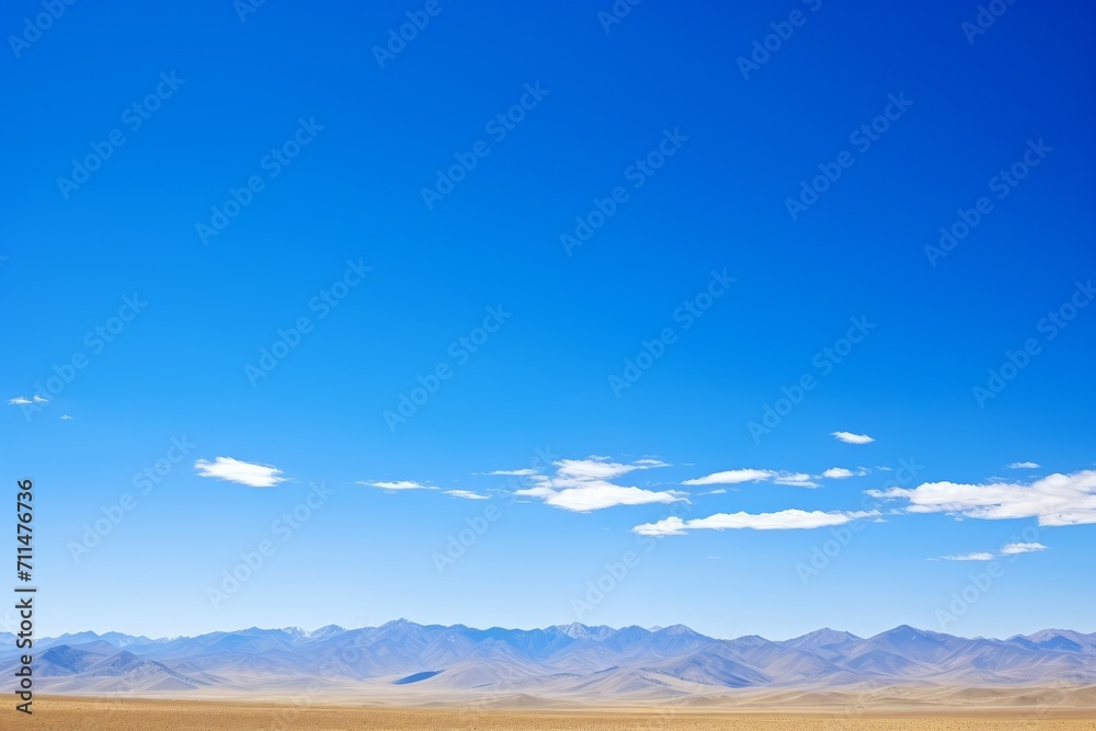 A seamless expanse of blue sky, interrupted only by the silhouettes of distant mountains, Generative AI