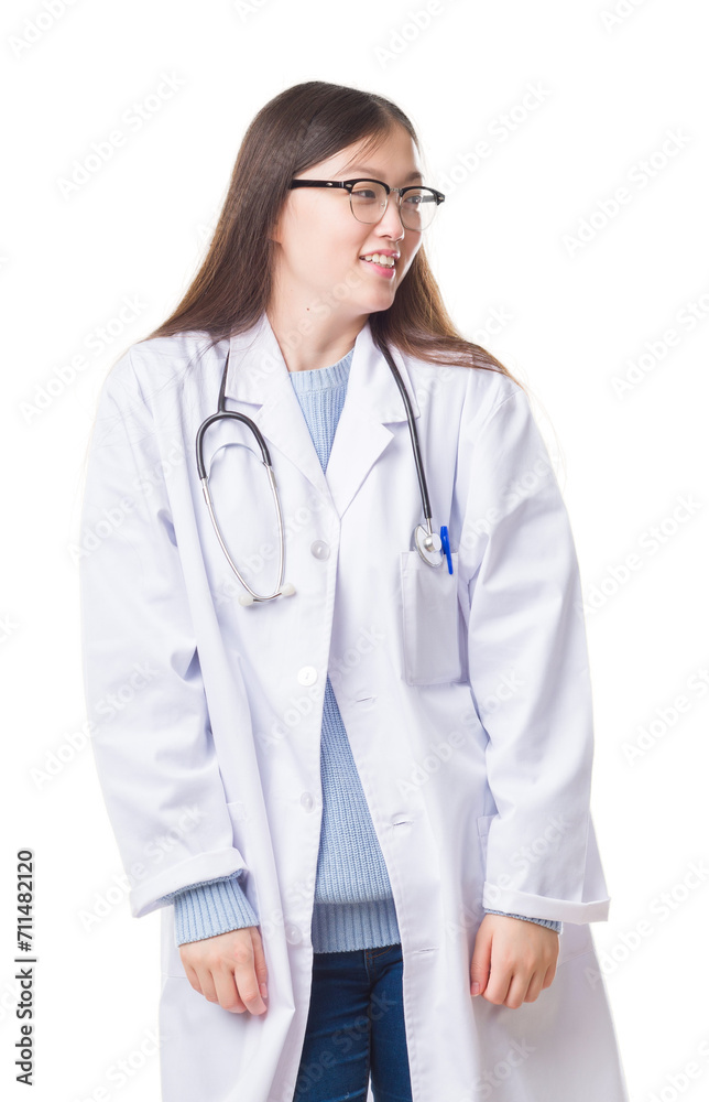 Young Chinese doctor woman over isolated background looking away to side with smile on face, natural expression. Laughing confident. Young Chinese doctor woman over isolated background looking away to side with smile on face, natural expression. Laughing confident.