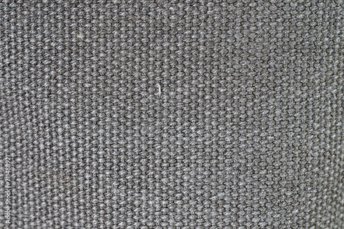 Gray woven or knit fabric texture surface. Top view, macro shot, no people © Octavian