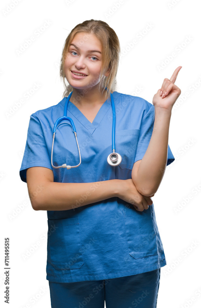 Young caucasian doctor woman wearing surgeon uniform over isolated background with a big smile on face, pointing with hand and finger to the side looking at the camera. Young caucasian doctor woman wearing surgeon uniform over isolated background with a big smile on face, pointing with hand and finger to the side looking at the camera.