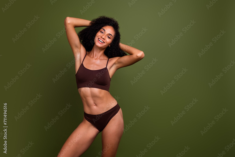 Studio no retouch photo of positive funky lady dressed lingerie accepting imperfections empty space isolated green color background Studio no retouch photo of positive funky lady dressed lingerie accepting imperfections empty space isolated green color background