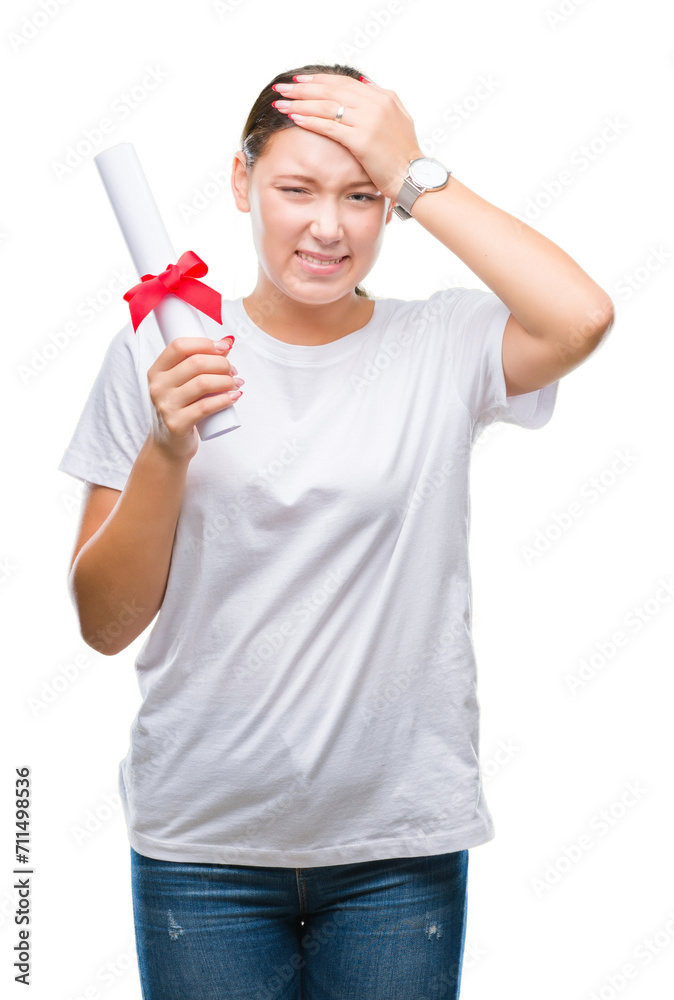 Young caucasian woman holding degree over isolated background stressed with hand on head, shocked with shame and surprise face, angry and frustrated. Fear and upset for mistake. Young caucasian woman holding degree over isolated background stressed with hand on head, shocked with shame and surprise face, angry and frustrated. Fear and upset for mistake.