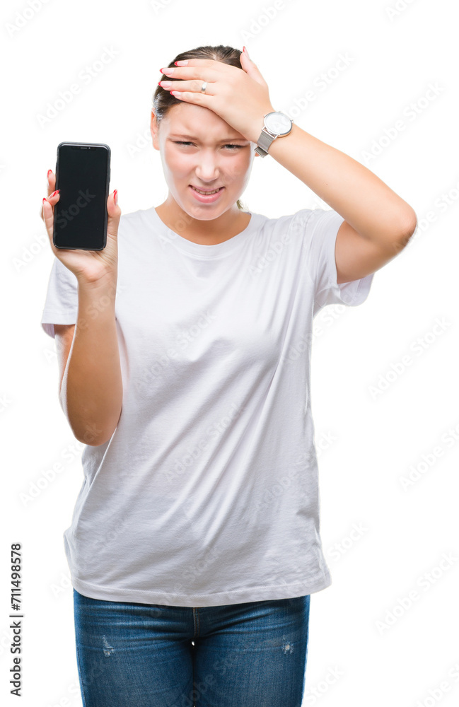 Young beautiful caucasian woman showing smartphone screen over isolated background stressed with hand on head, shocked with shame and surprise face, angry and frustrated. Fear and upset for mistake. Young beautiful caucasian woman showing smartphone screen over isolated background stressed with hand on head, shocked with shame and surprise face, angry and frustrated. Fear and upset for mistake.
