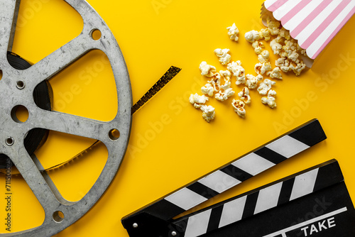 Cinema concept with film reels and popcorn. Movie background