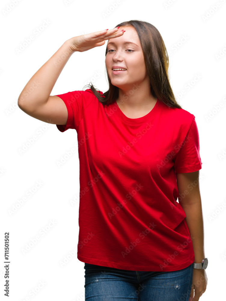 Young beautiful caucasian woman over isolated background very happy and smiling looking far away with hand over head. Searching concept. Young beautiful caucasian woman over isolated background very happy and smiling looking far away with hand over head. Searching concept.