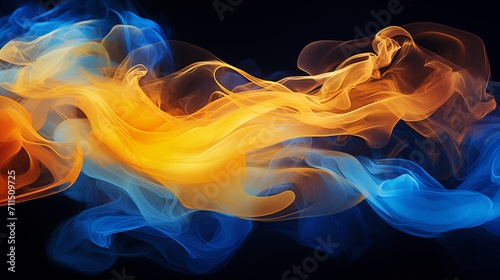 Abstract yellow and blue smoke on black background with swirling air humidifier steam