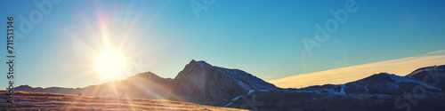 Mountain landscape with blue clear sky during sunset in autumn. The Pyrenees Mountains In Andorra. Horizontal banner