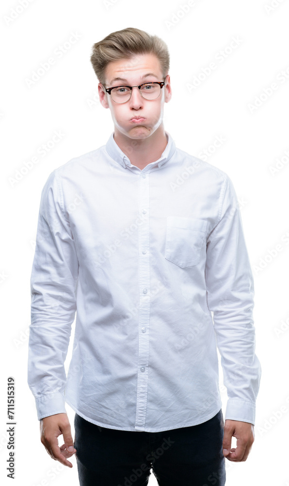Young handsome blond man puffing cheeks with funny face. Mouth inflated with air, crazy expression. - obrazy, fototapety, plakaty 