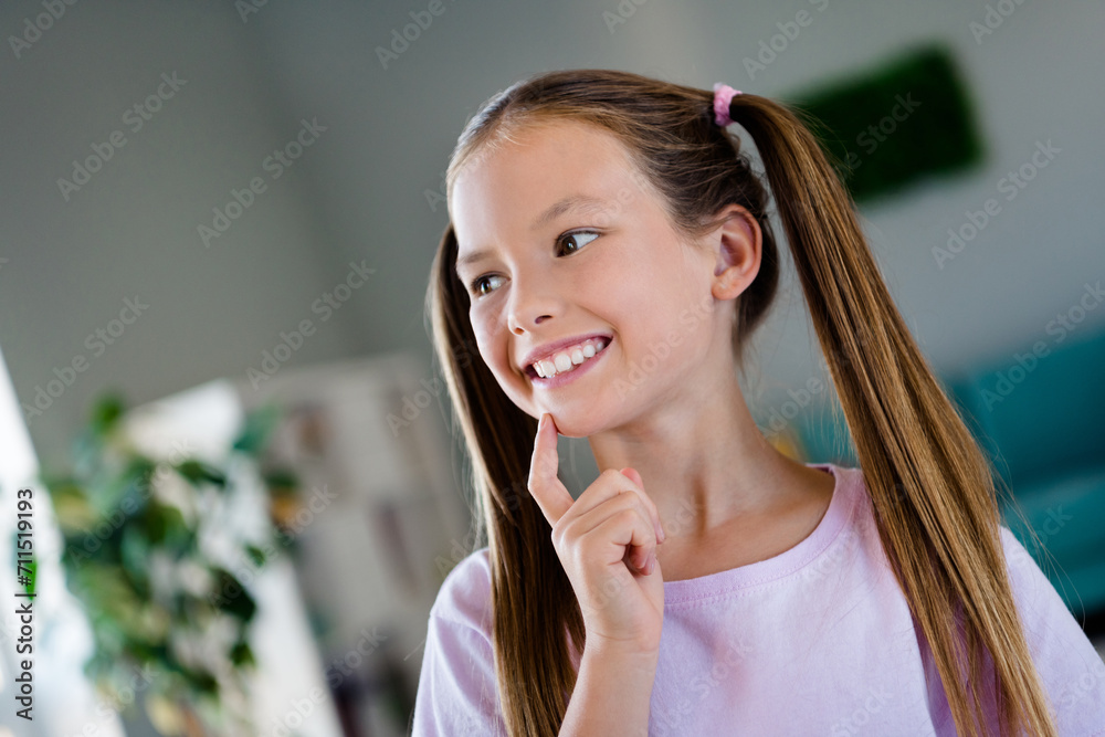 Photo of lovely creative schoolchild finger touch chin toothy smile look curious away imagine apartment inside Photo of lovely creative schoolchild finger touch chin toothy smile look curious away imagine apartment inside