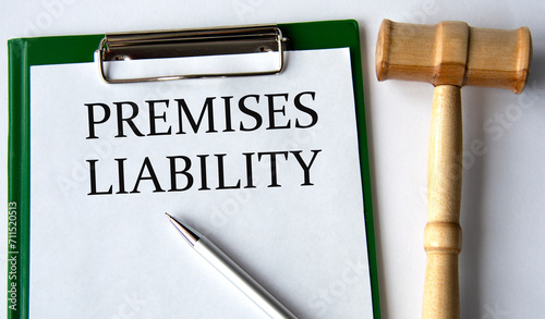 Fotografía PREMISES LIABILITY - words on a white sheet on a white background and a judge's