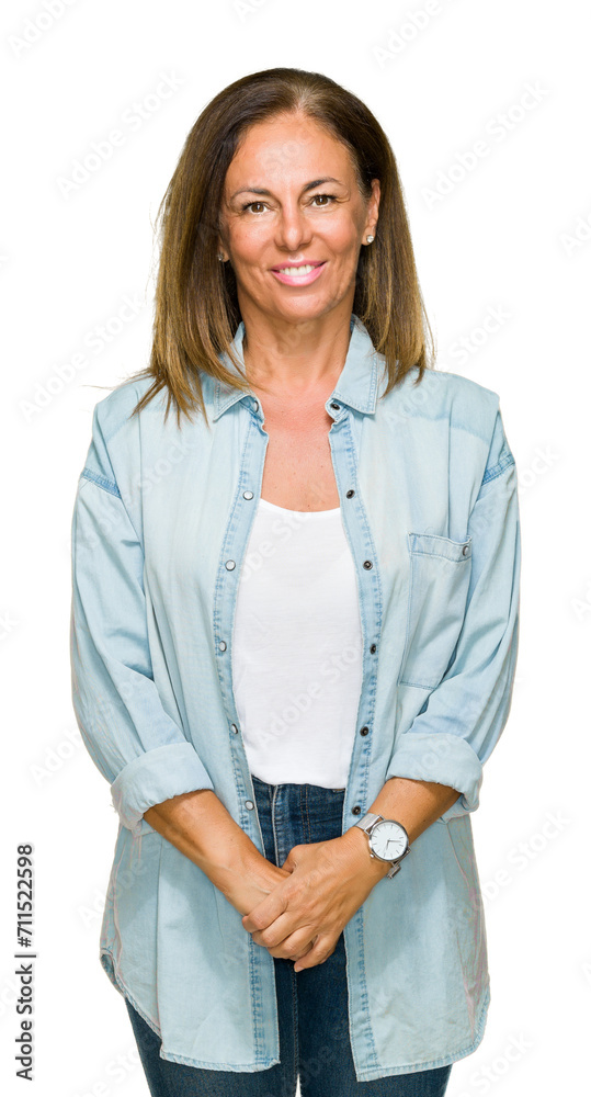 Middle age adult woman wearing casual denim shirt over isolated background with a happy and cool smile on face. Lucky person.
