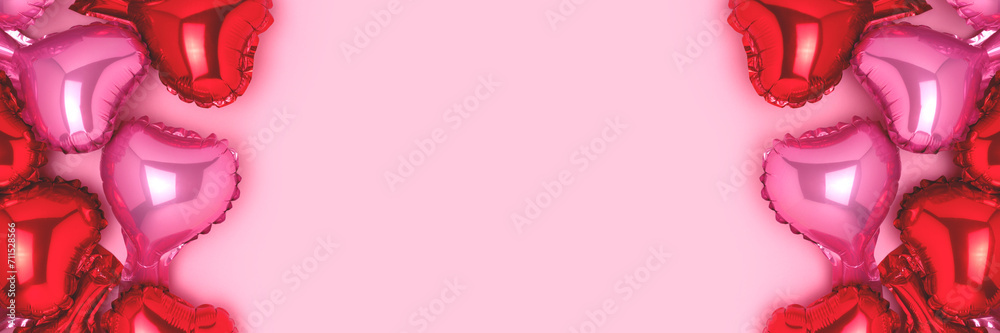 Banner with frame made of red and pink foil balloons in a heart shape. Place for text.