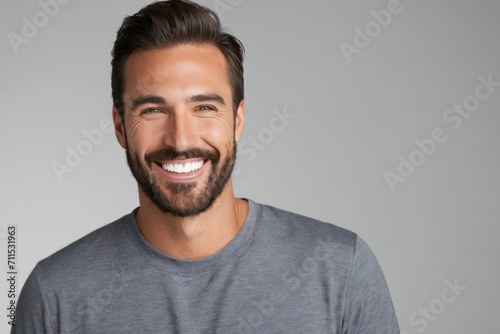 Portrait smiling brutal bearded man with white teeth, healthy hair and skin. Concept of studio shot of advertising a dentist and facial care. Generative AI