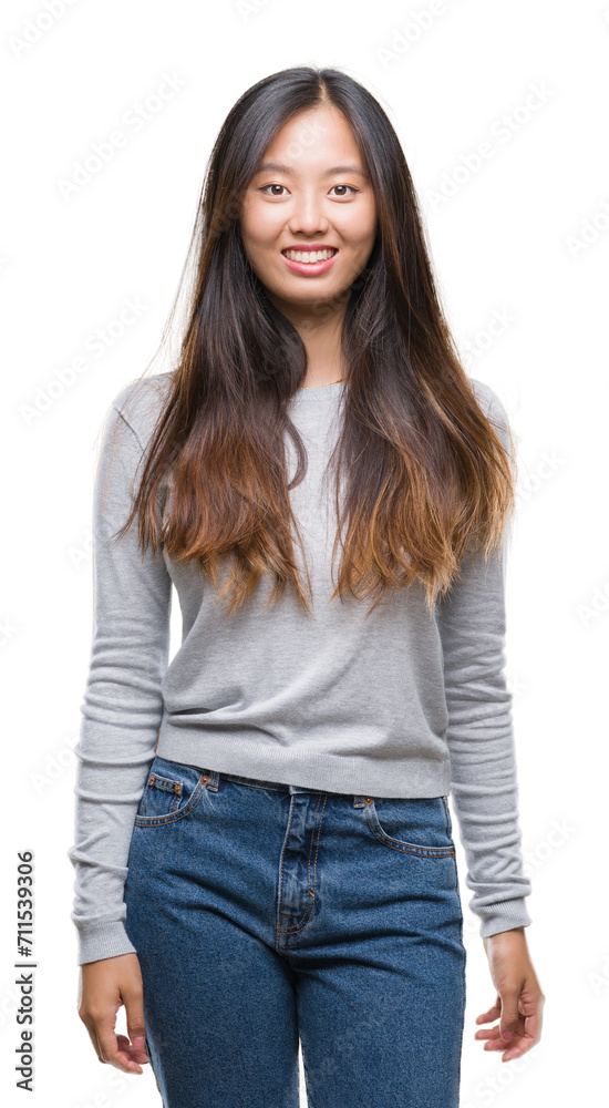 Young asian woman over isolated background with a happy and cool smile on face. Lucky person. Young asian woman over isolated background with a happy and cool smile on face. Lucky person.