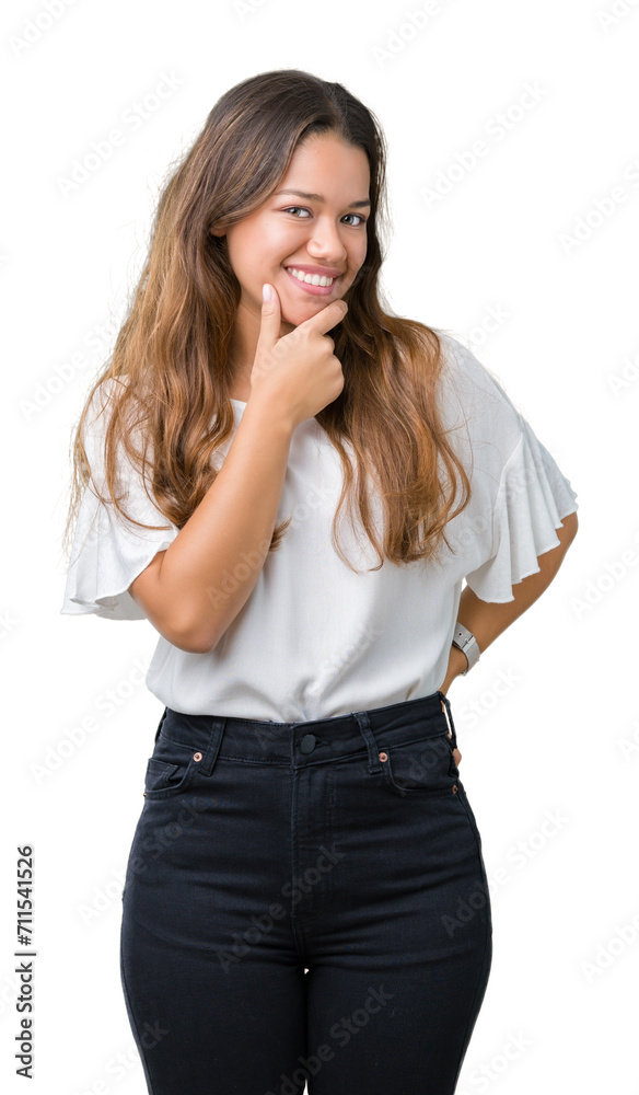 Young beautiful brunette business woman over isolated background looking confident at the camera with smile with crossed arms and hand raised on chin. Thinking positive. Young beautiful brunette business woman over isolated background looking confident at the camera with smile with crossed arms and hand raised on chin. Thinking positive.