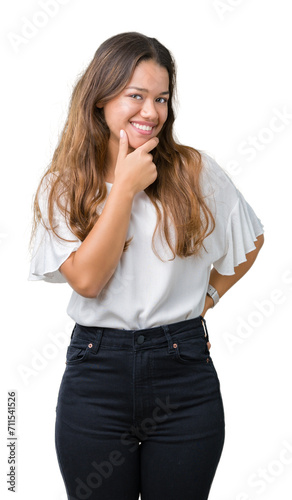 Young beautiful brunette business woman over isolated background looking confident at the camera with smile with crossed arms and hand raised on chin. Thinking positive.