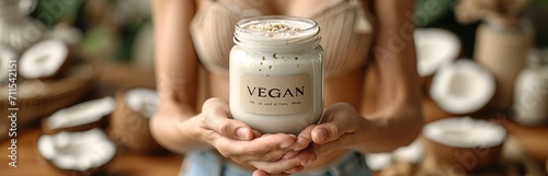 Natural vegan coconut cream in a glass jar with the inscription "VEGAN", surrounded by fresh palm fruits and shavings, Concept: healthy and ethical lifestyle, eco-friendly cosmetics