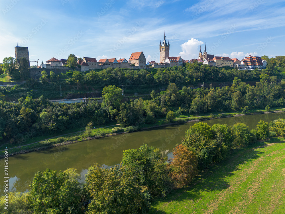 Bad Wimpfen with a view of the old church and the historic city wall over fields, drone shoot
