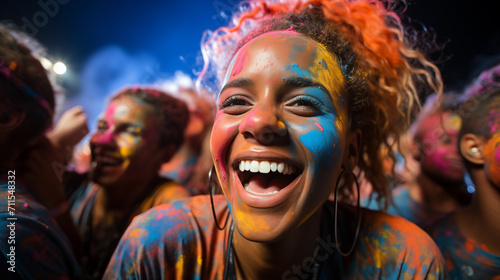 A girl smiles in the crowd at the Holi festival.