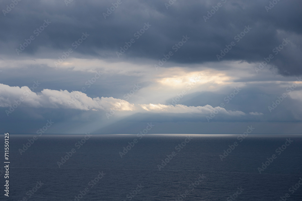 custom made wallpaper toronto digitalClouds on the sea.
Light ray of the sun through the clouds on the blue sea. Liguria, Italy.